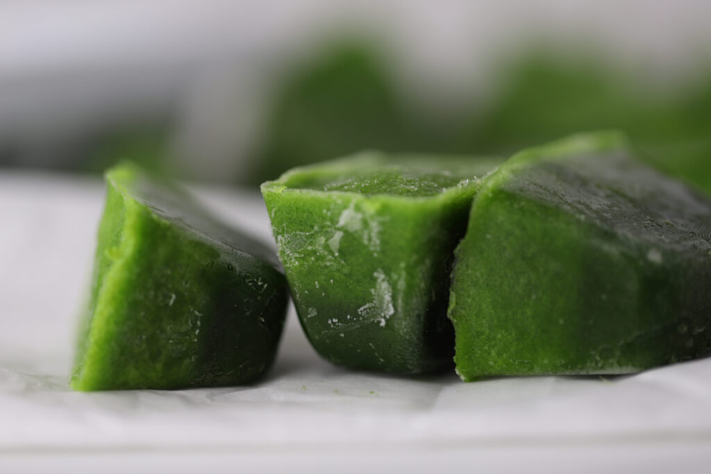 spinach and kale frozen into ice cubes for smoothies