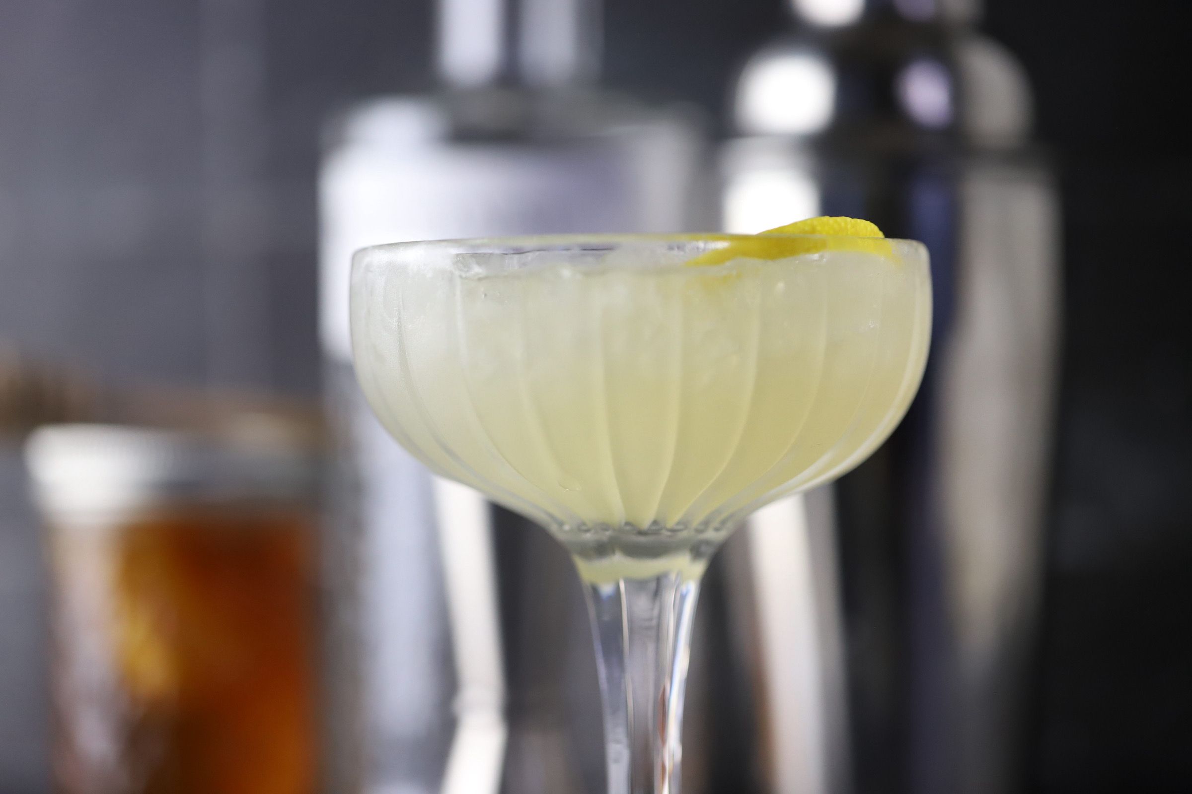 bees knees cocktail in a coupe glass