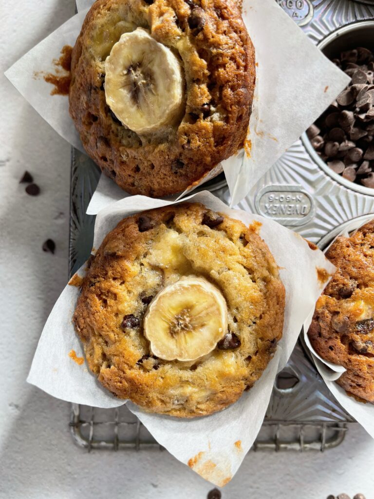 chocolate chip banana muffins in a metal muffin baking tin