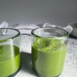 kale mango smoothies in a glass cup