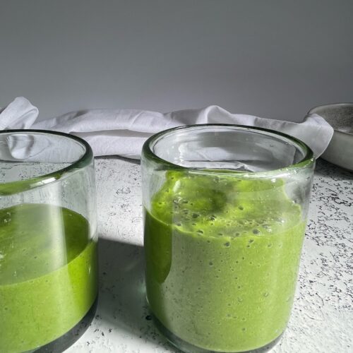 kale mango smoothies in a glass cup